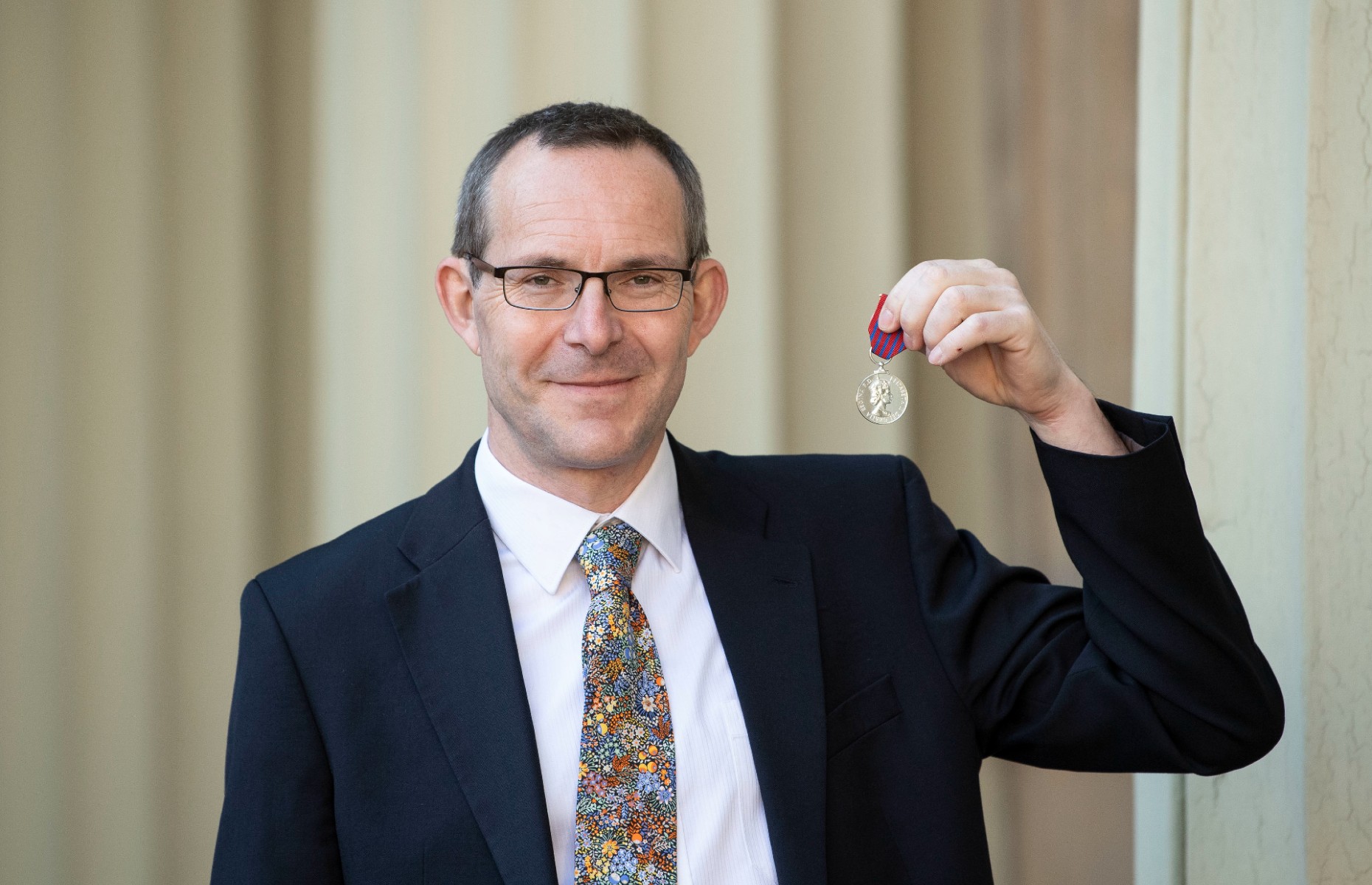 John receives a George Medal at Buckingham Palace in February 2019 (Image: VICTORIA JONES/AFP via Getty Images)