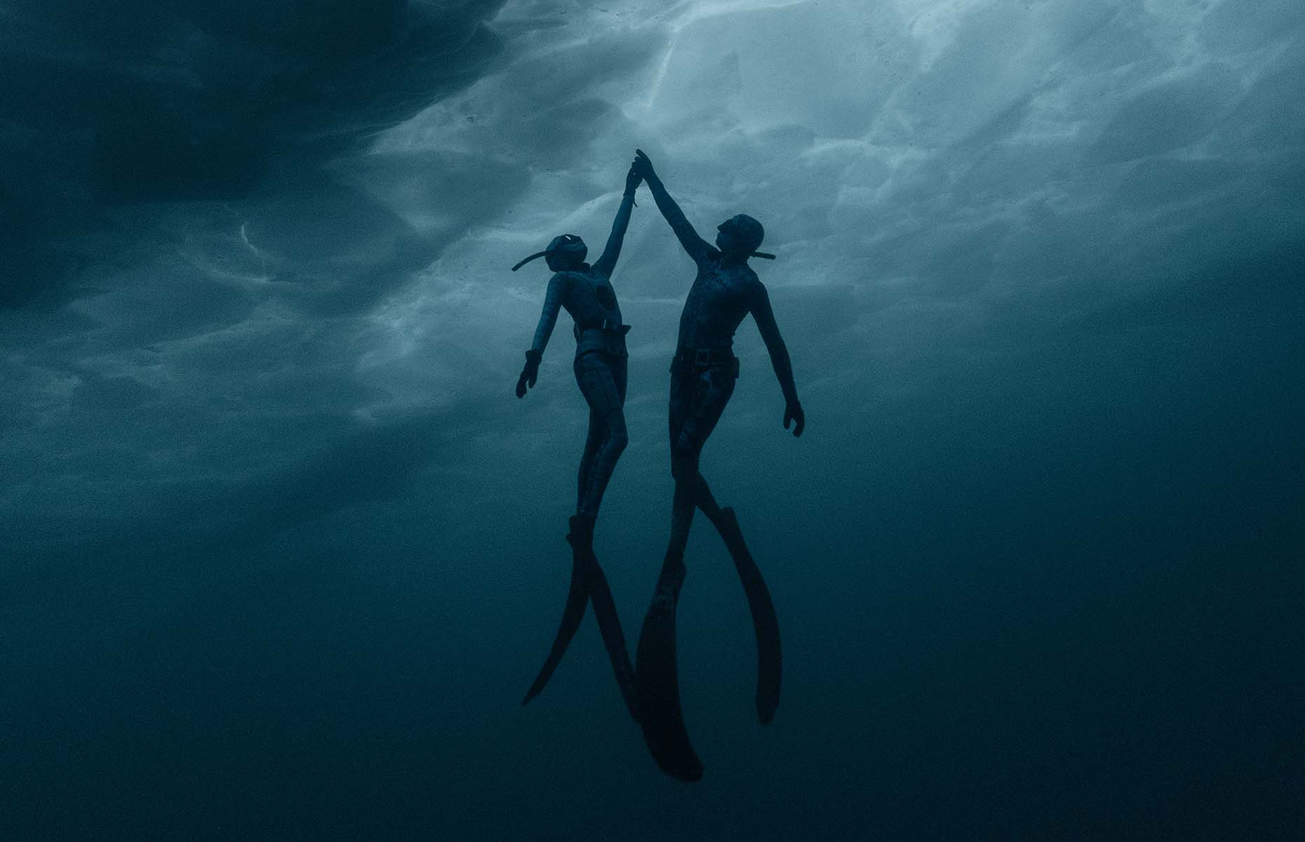 Lily and Andrew diving in Lake Huron (Image: © Geoff Coombs. Originally published alongside Change in a Single Breath by Lilly Ryzebol with Andrew Ryzebol in Sidetracked magazine.)