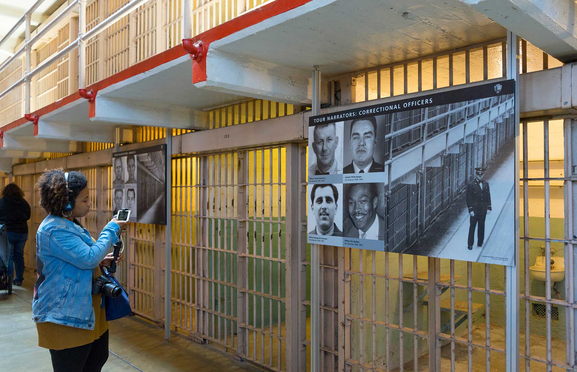 Woman following audio guide at the Alcatraz museum (Image: Shutterstock/Ben Bryant)