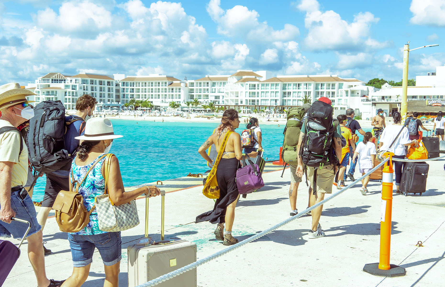 Tourists arriving at their holiday destination (Image: Semyon Nazarov/Shutterstock) 