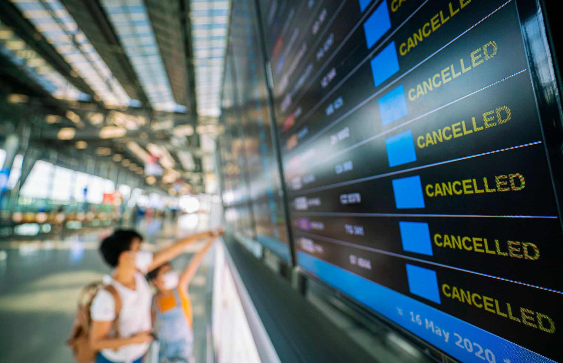 Cancelled flights on digital board (Image: People Image Studio/Shutterstock)