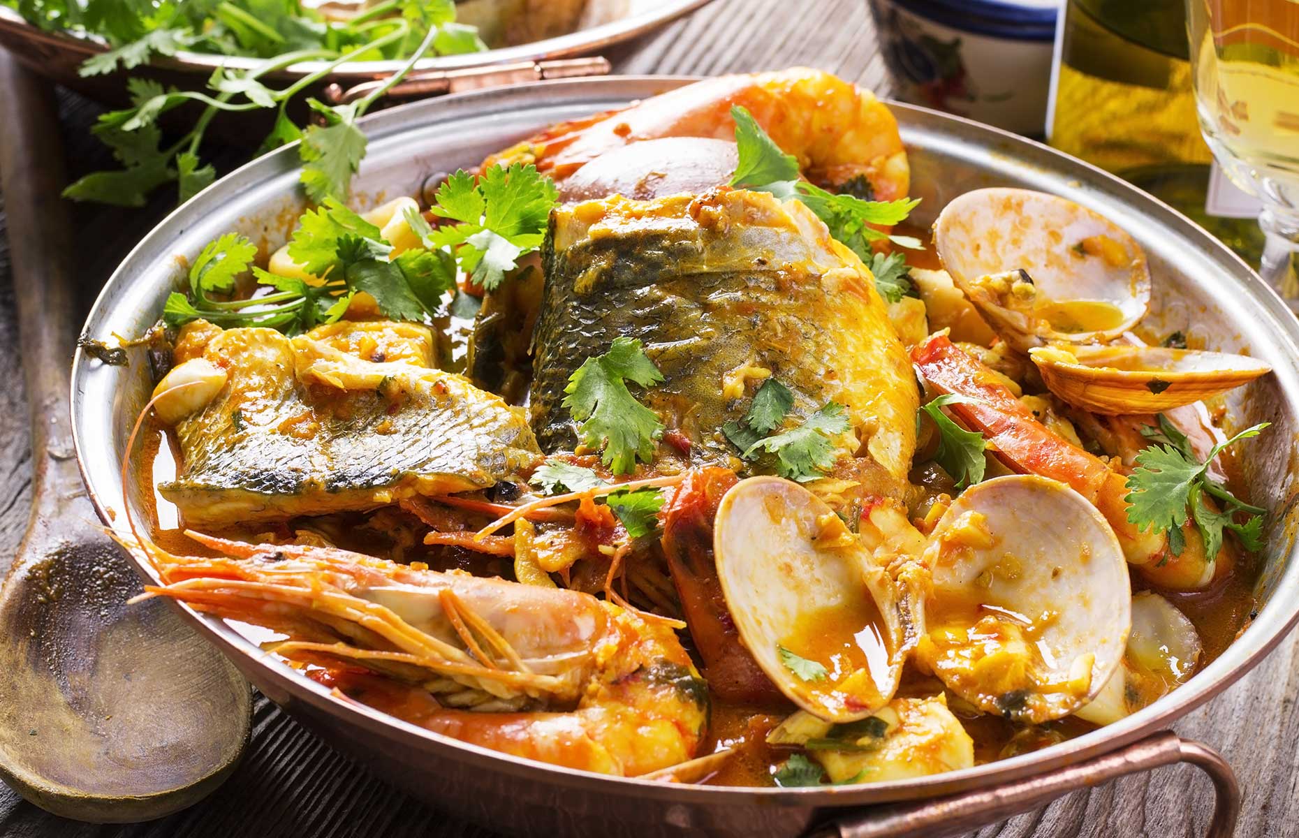 Cataplanas (pork and seafood) is a typically Algarvian dish (Image: hlphoto/Shutterstock)