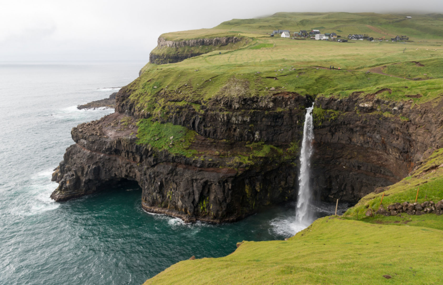 Múlafossur waterfall in the tiny village of Gasadalur is one of the top things to see in the Faroe Islands