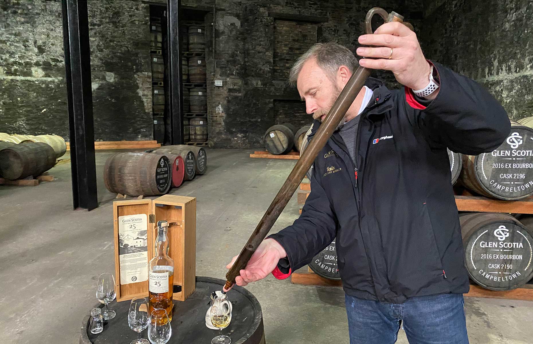 Iain McAlister, pours a wee dram into a glass at the Glen Scotia distillery in Campbeltown, Scotland (Image: Copyright Robin McKelvie)