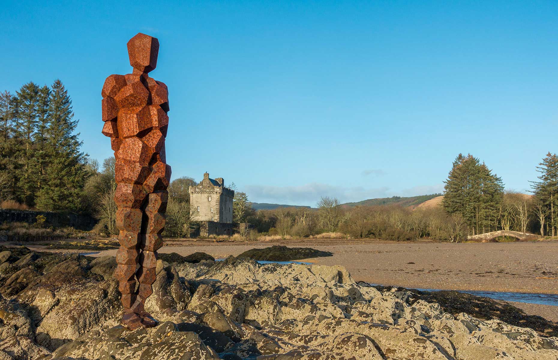 Antony Gormley's statue at Saddell Bay, Scotland on a sunny day (Image: Rebecca Cole/Alamy Stock Photo)