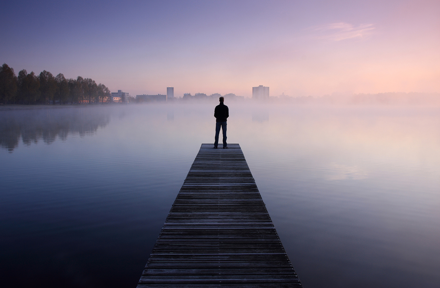 Man standing on jetty, Digital Detox Holidays