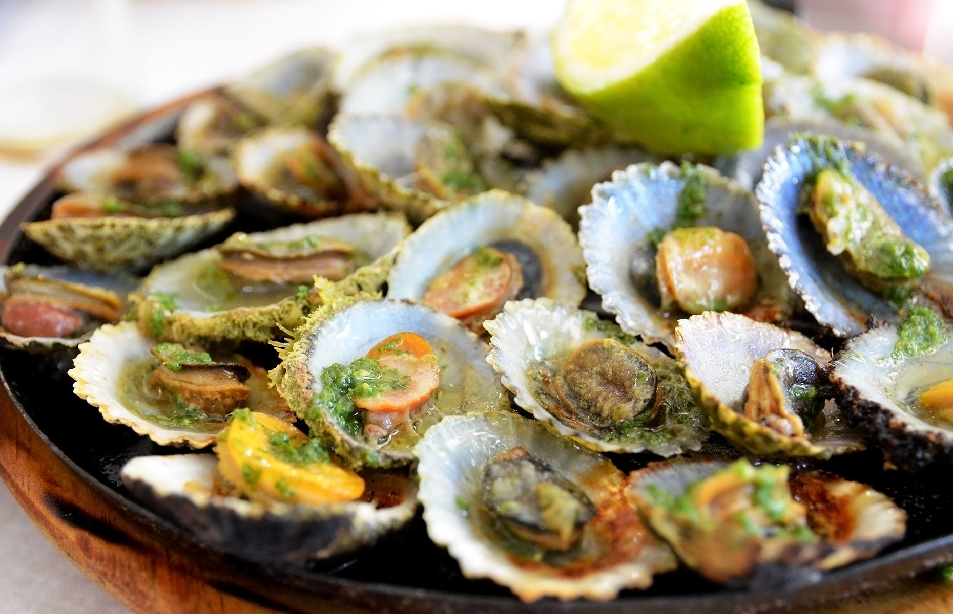 Lapas grelhadas or grilled limpets is a local speciality (Image: svf74/Shutterstock)