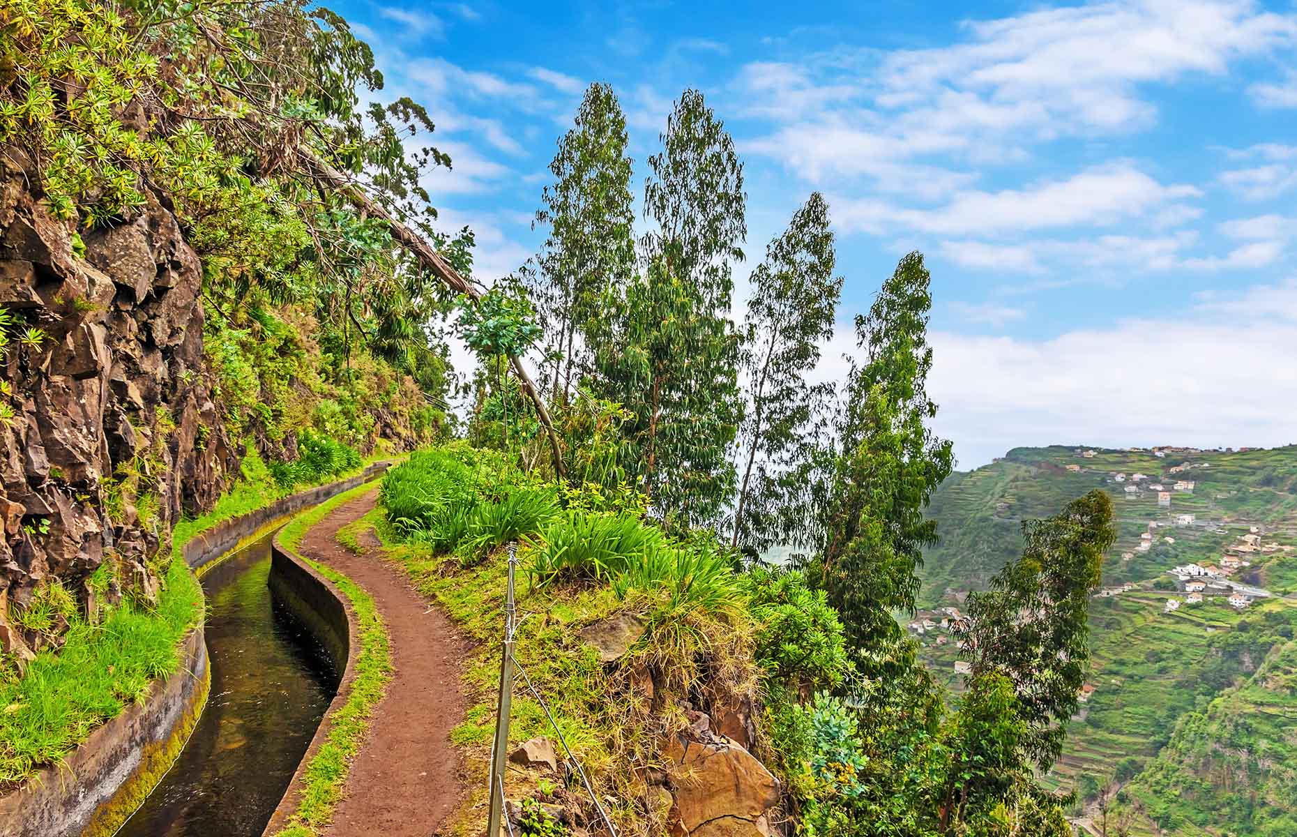 Hiking along irrigation channel (Levada) in Madeira (Image: aldorado/Shutterstock)