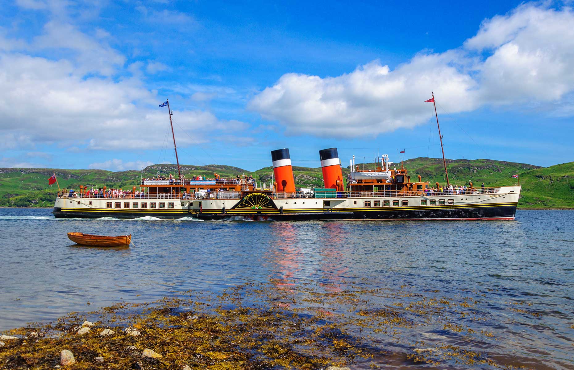Waverley paddle steam with Isle of Bute in the background (Image: Skully/Shutterstock)