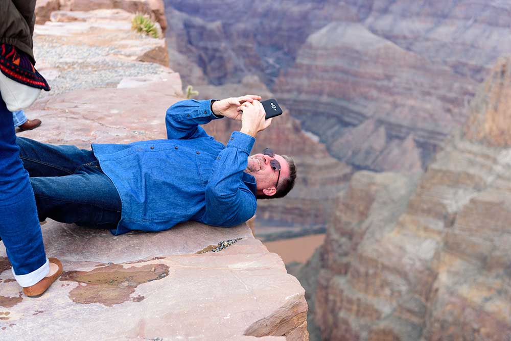 Man takes selfie on cliff edge