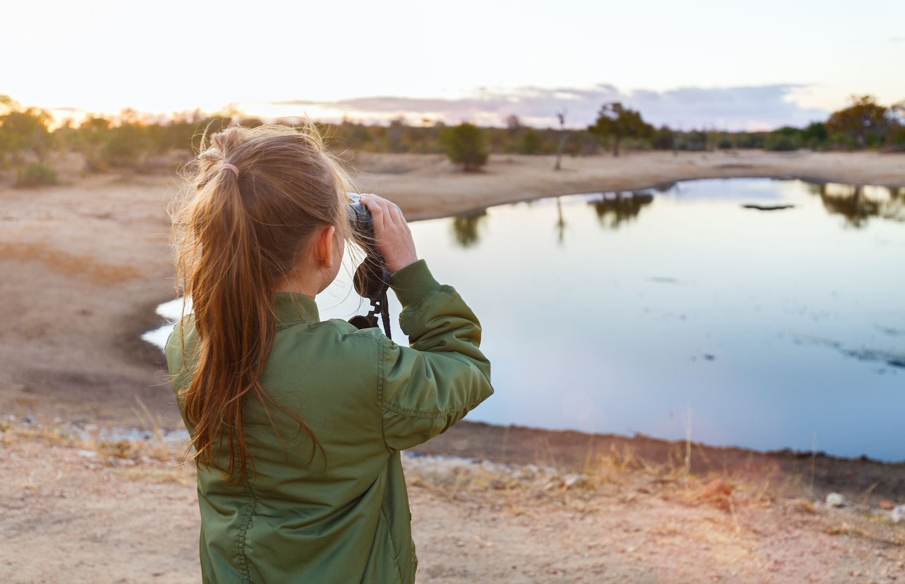 Girl on safari with binoculars