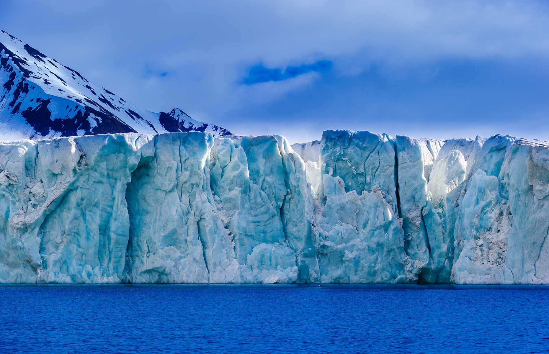 Aqua-coloured glacier, Svalbard (Don Landwehrle/Shutterstock)