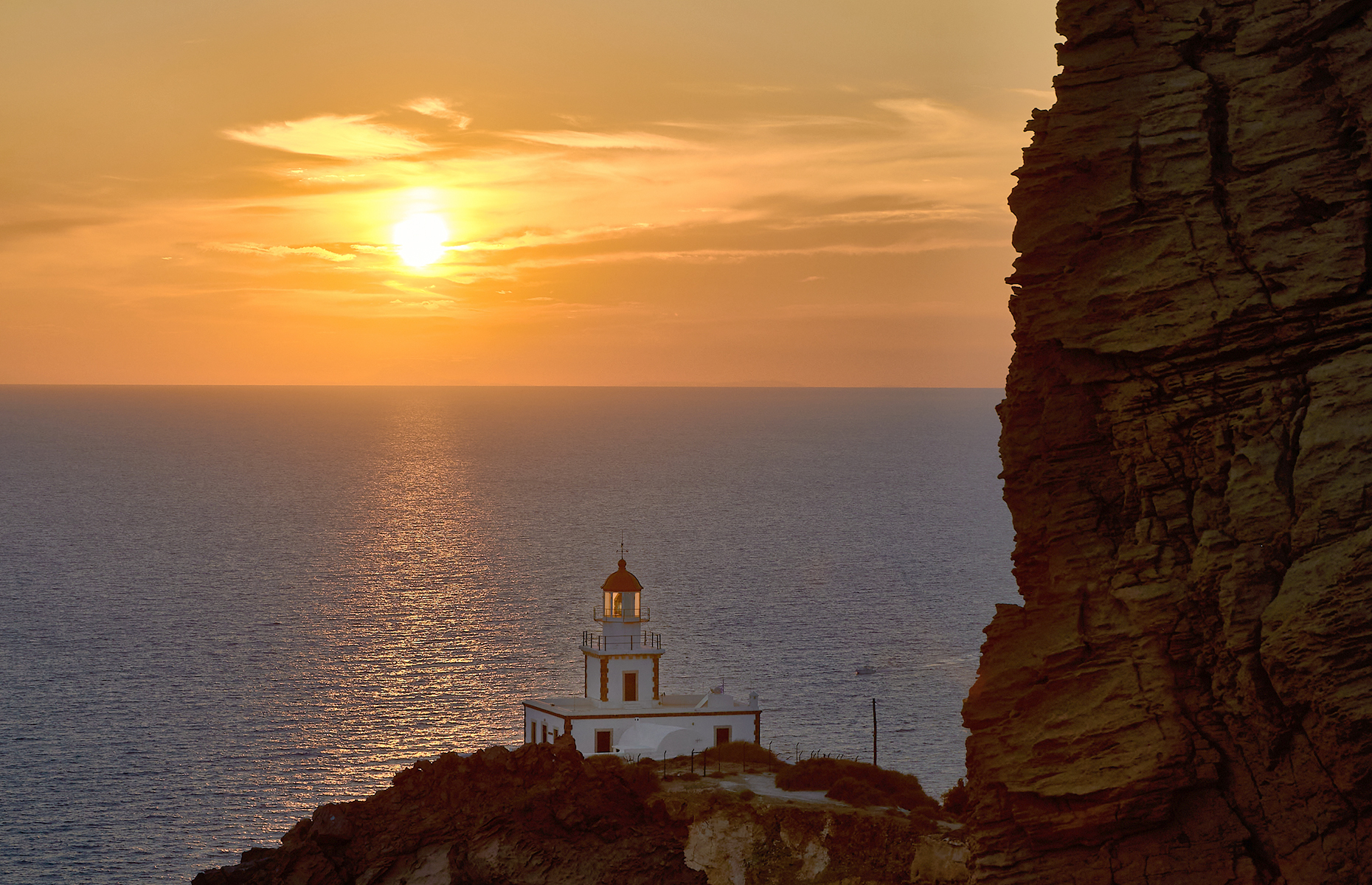 Sunset at Akrotiri lighthouse, Santorini. (Image: Jdiezfoto - Juan DYB/Shutterstock)