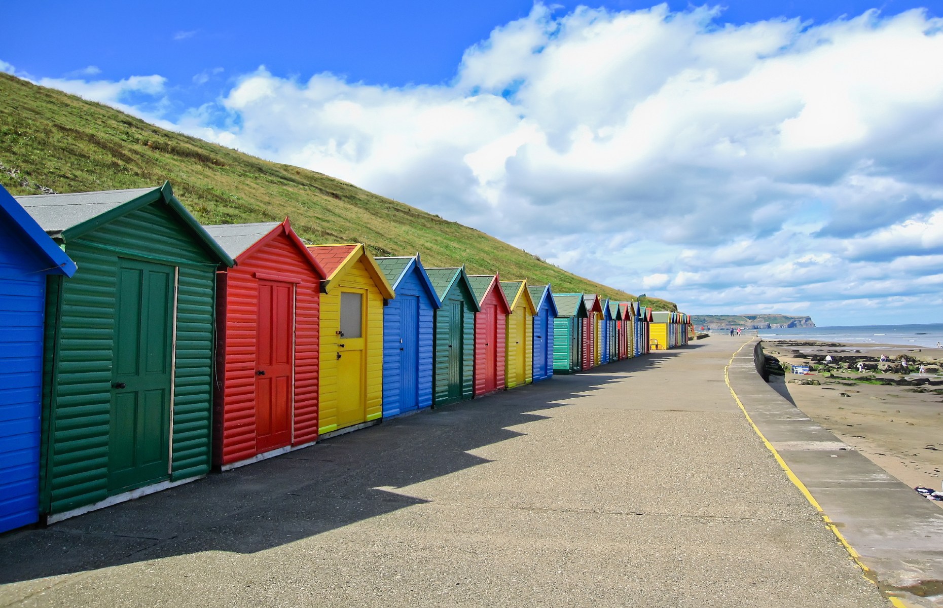 Beach huts on Whitby Sands (Image: Javen/Shutterstock)