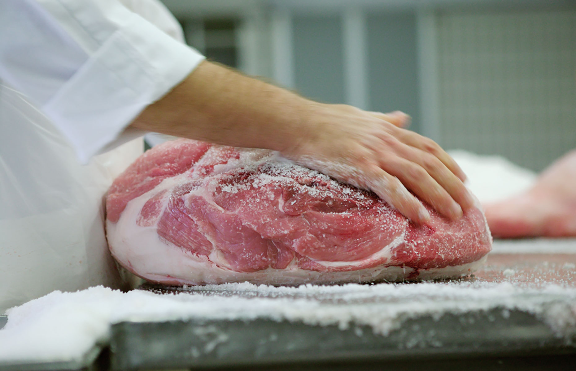 Salting a leg of ham (Image courtesy of Consorzio del Prosciutto di Parma)