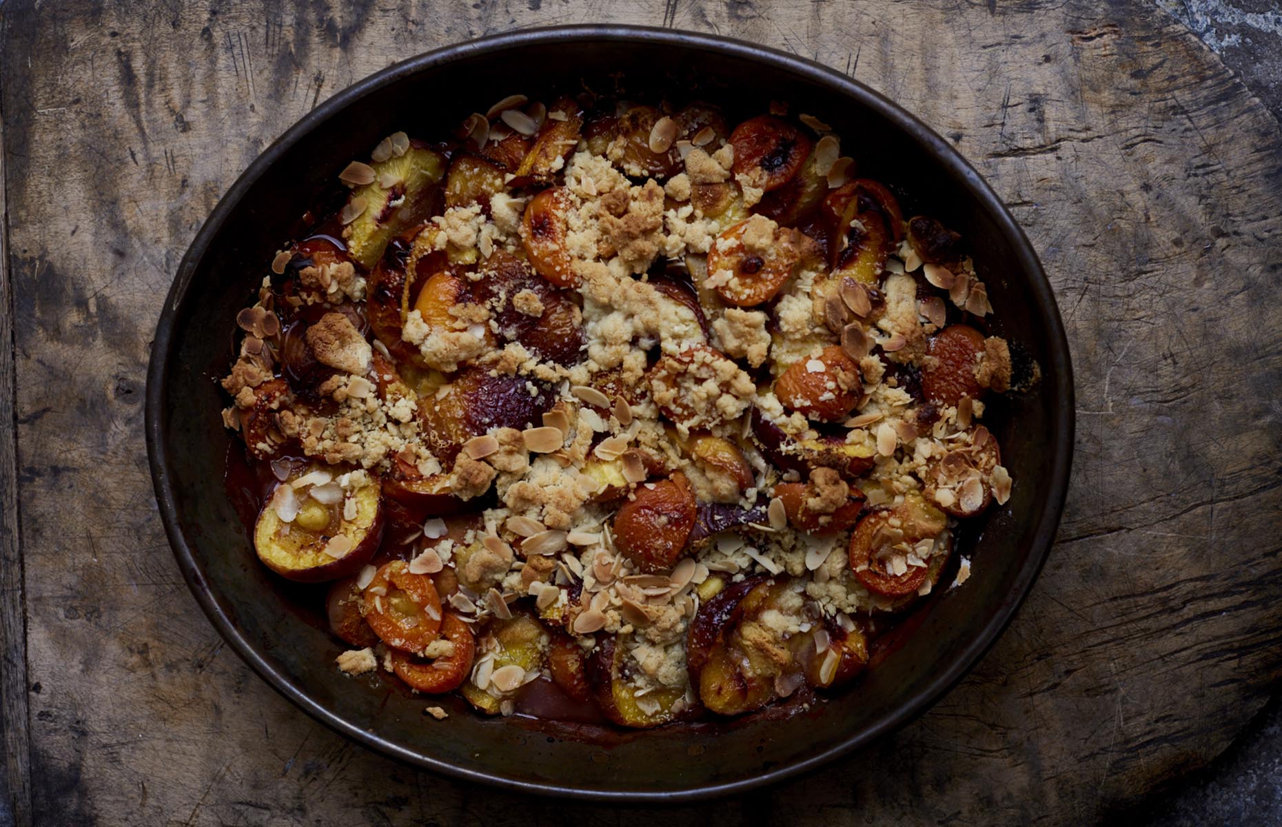 Roast stone fruit with almond and orange flower crumb (Image: From the Oven to the Table/Mitchell Beazley)