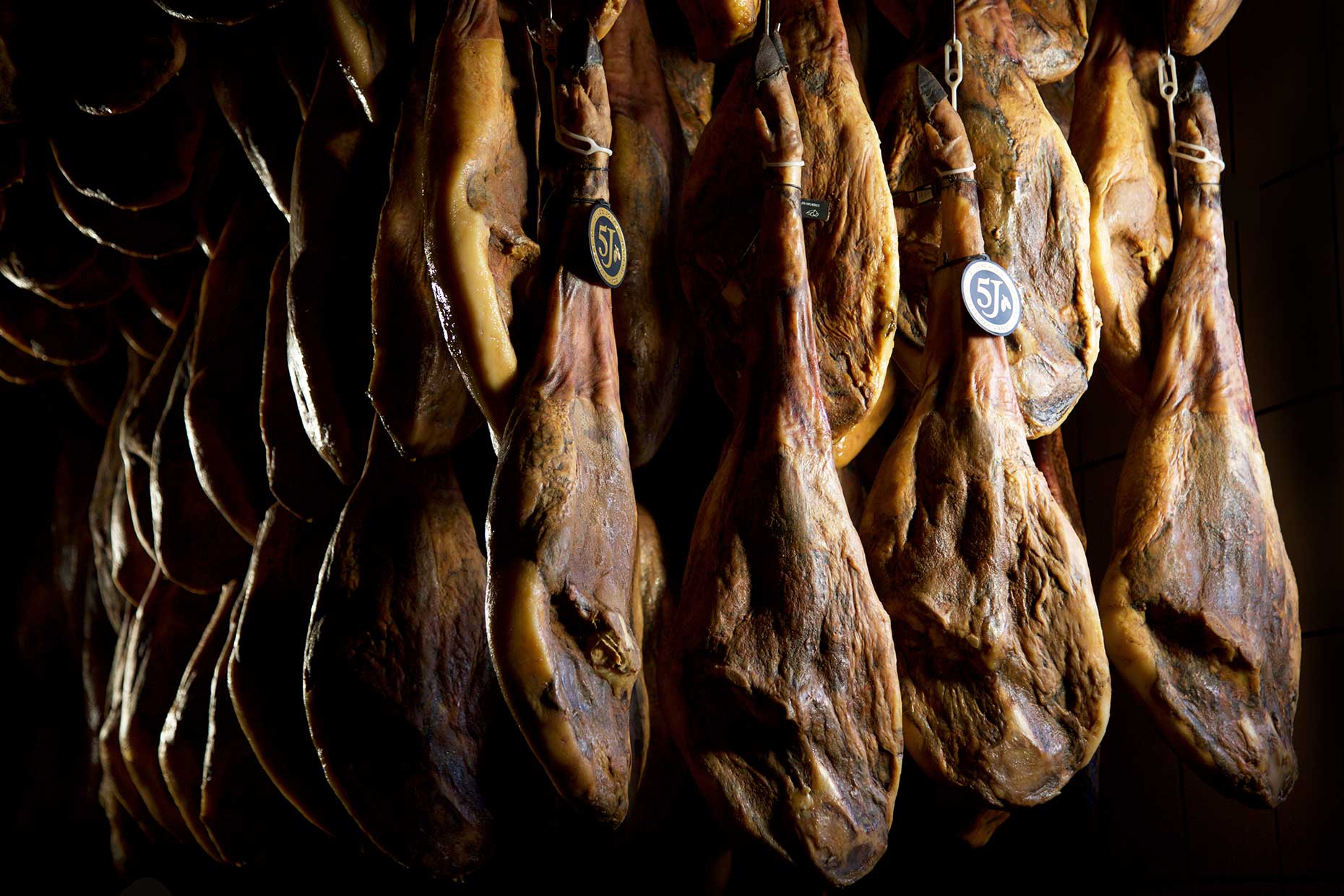 Legs of jamón ibérico curing (Image: Courtesy of Cinco Jotas)