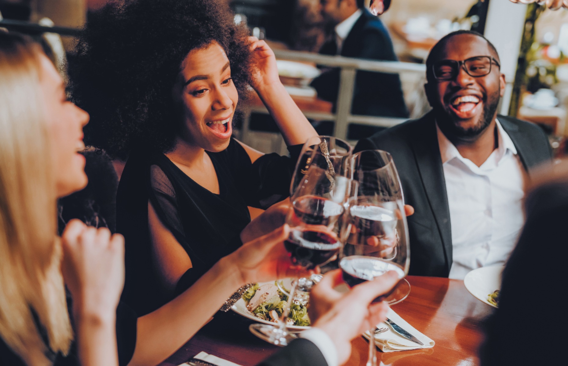 Friends enjoying wine (Image: VGstock Studio/Shutterstock)