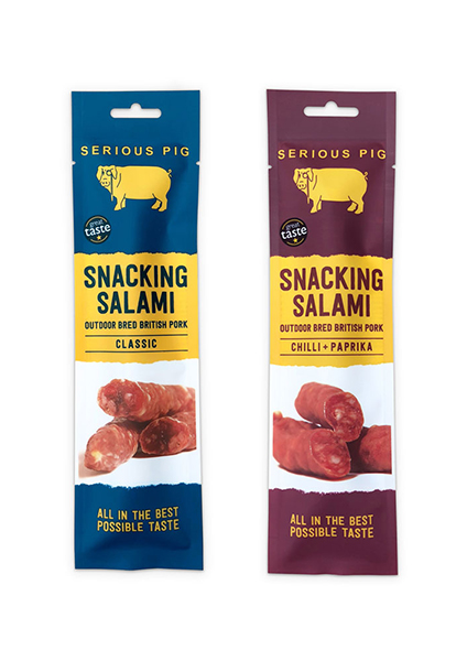 Serious Pig snacking salami