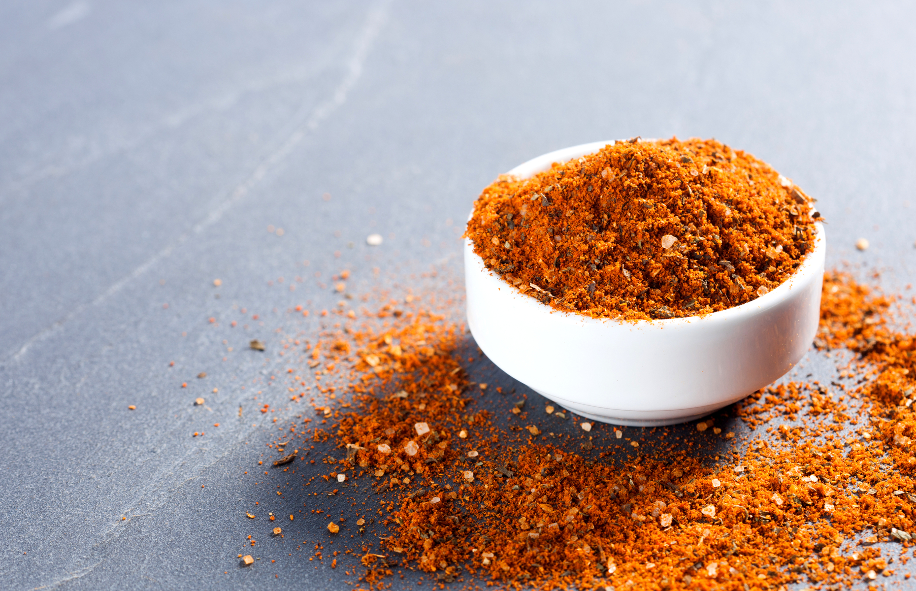 Ground chillies and spices for harissa in a pot (Image: avs/Shutterstock)