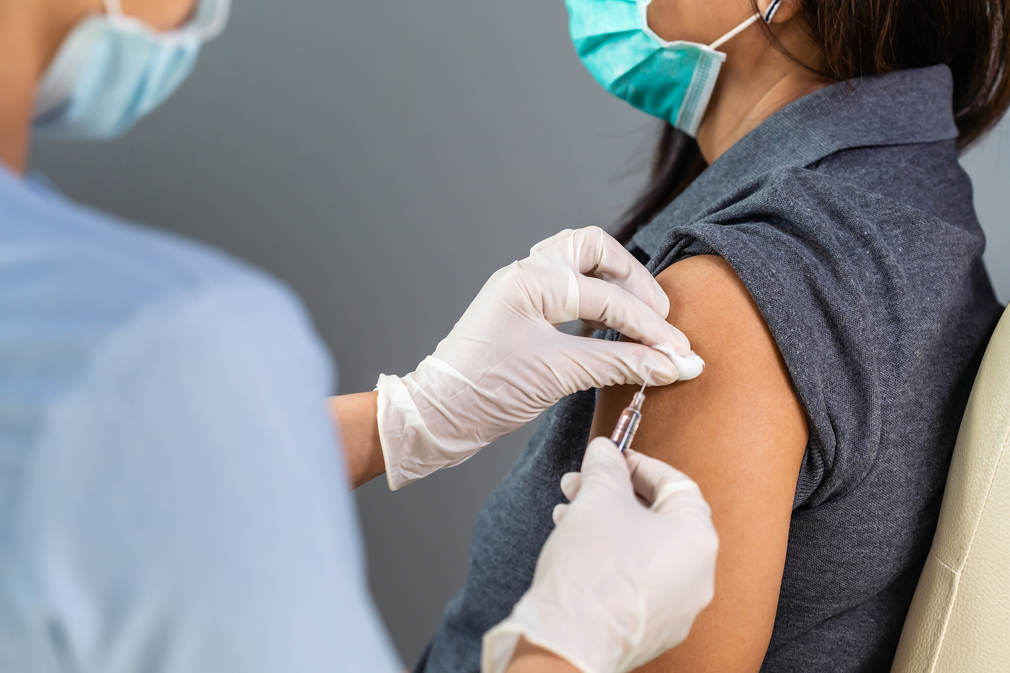 Woman getting coronavirus vaccine jab. (Image: Shutterstock)