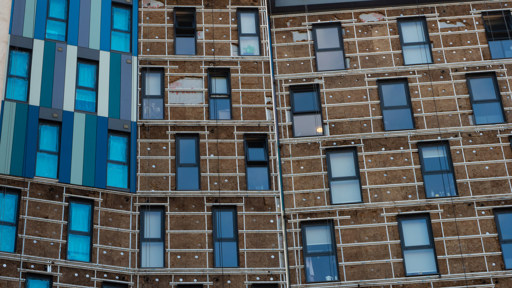 Cladding being removed from a building (Image: Shutterstock)