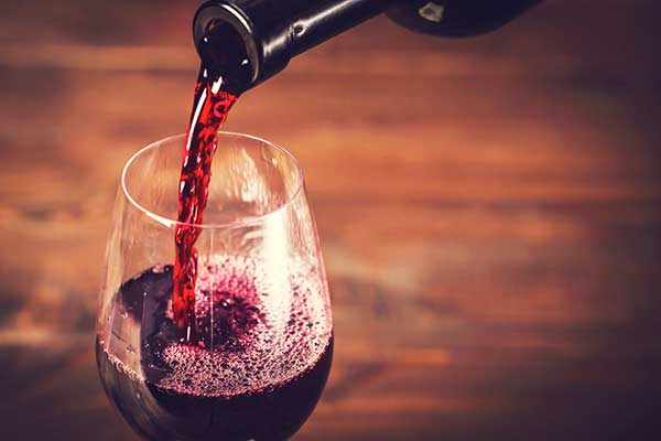 Wine poured into a glass. (Image: Shutterstock)