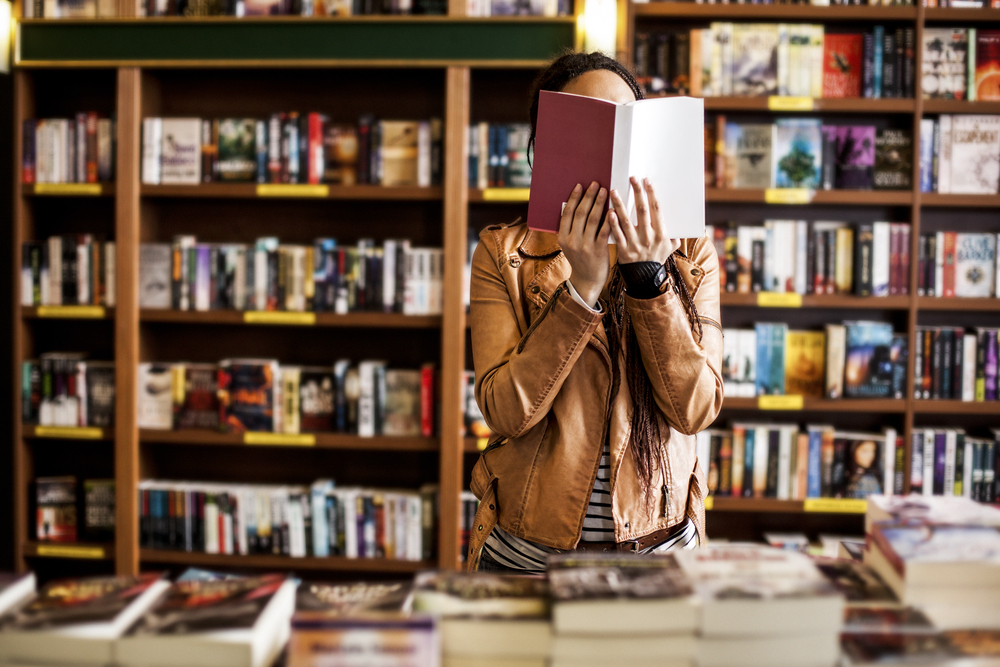 Woman reading a book. (Image: Shutterstock)