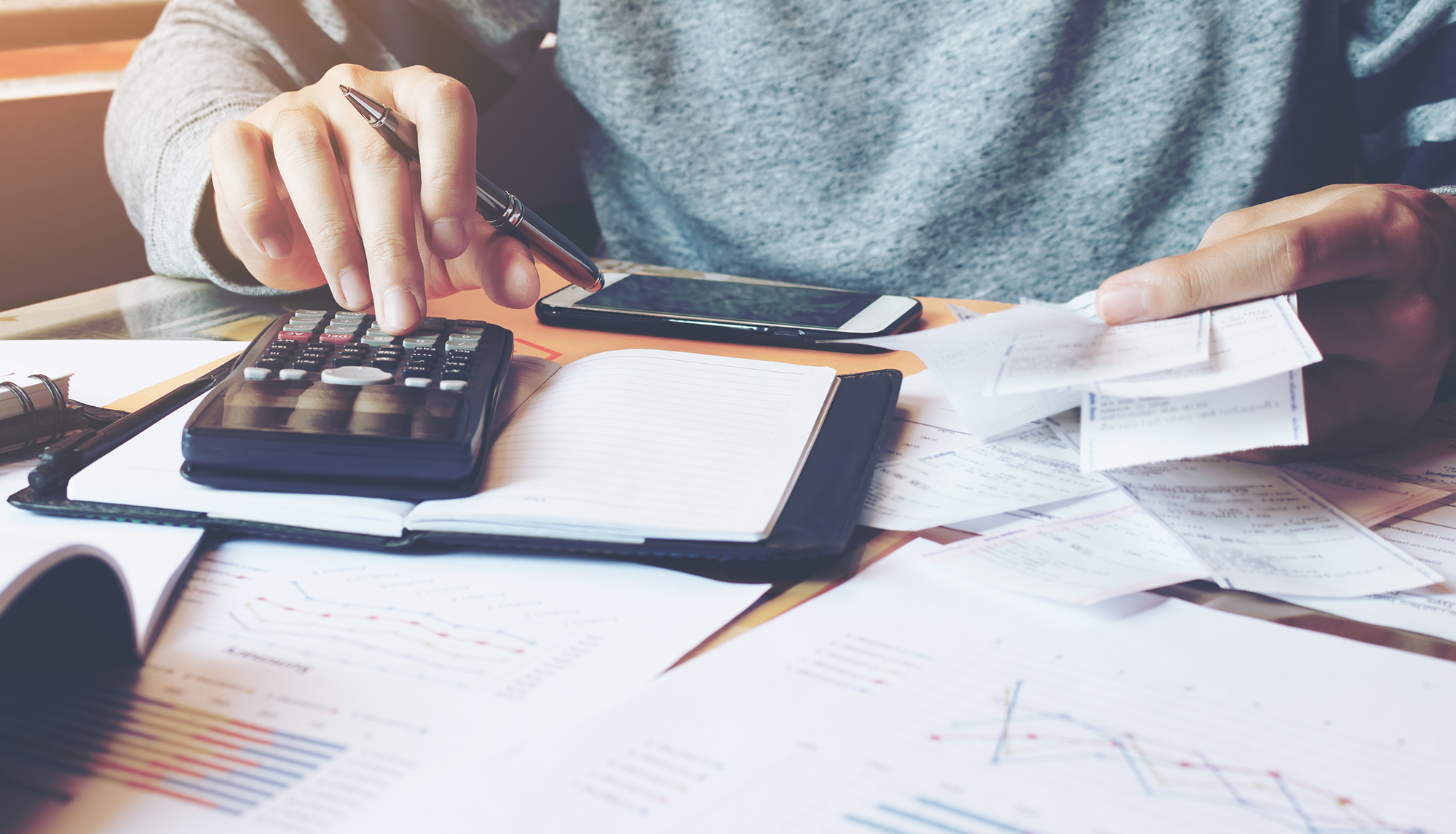 Person sorting out bills. (Image: Shutterstock)