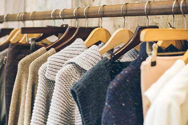 Clothes on a clothes rack. (Image: Shutterstock)