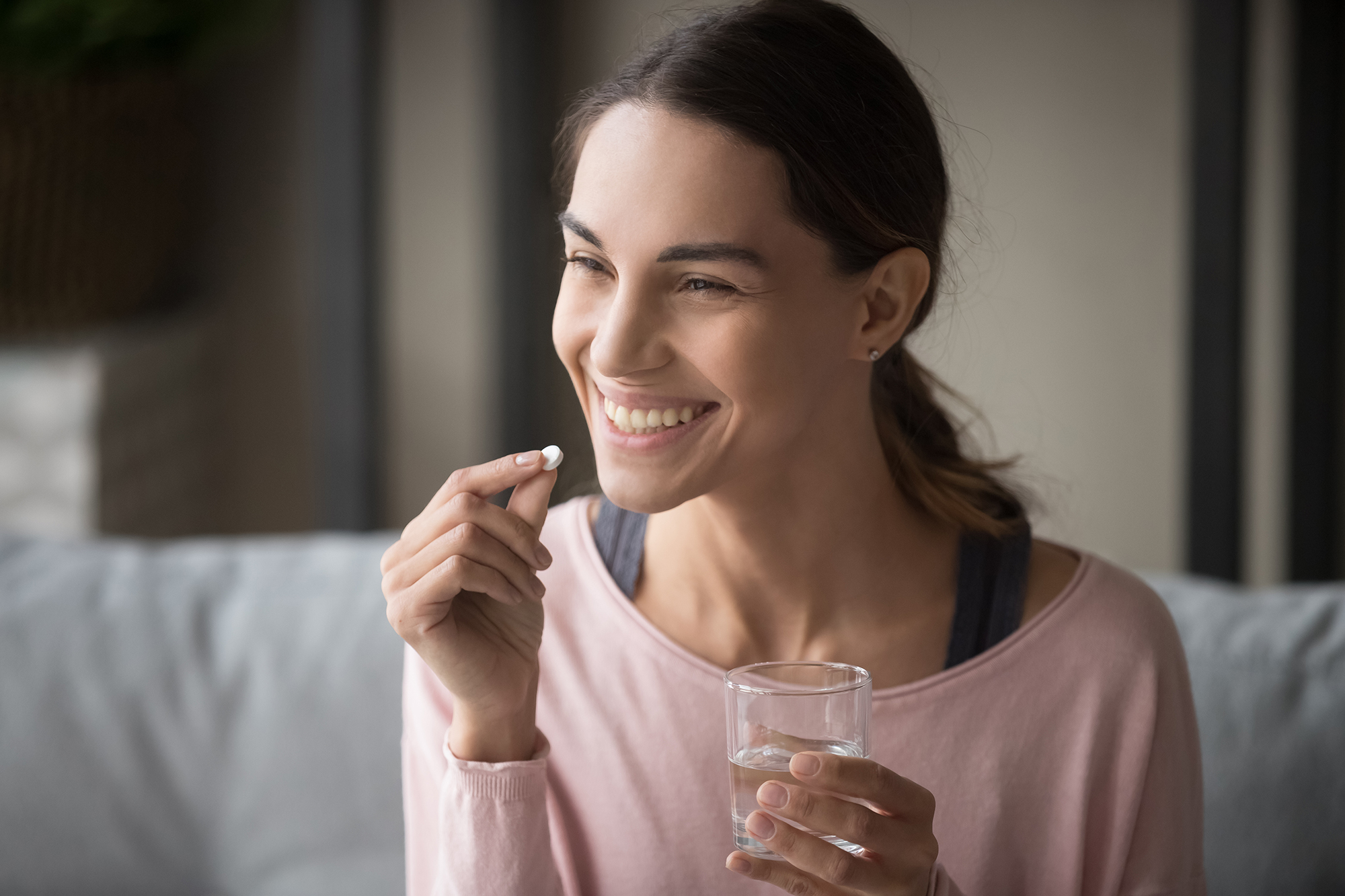 Woman taking medication. (Image: Shutterstock)