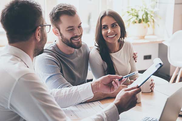 A couple with a contract. (Image: Shutterstock)