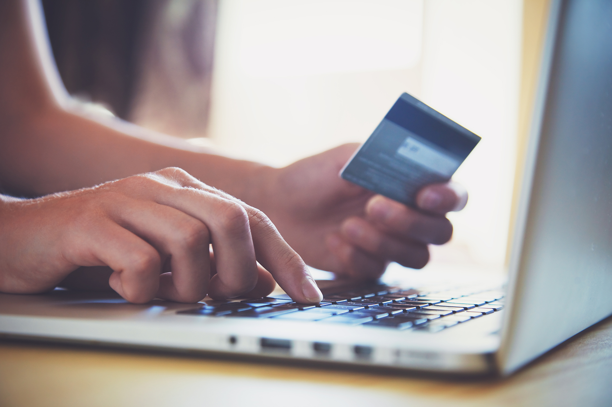 Someone using their card online. (Image: Shutterstock)