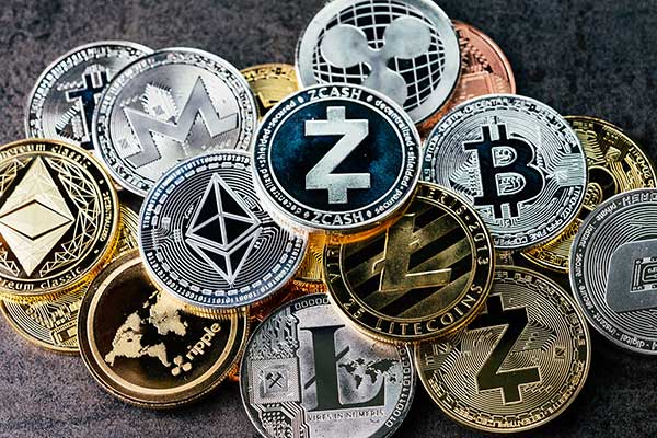 Various physical cryptocurrency coins. (Image: Shutterstock)