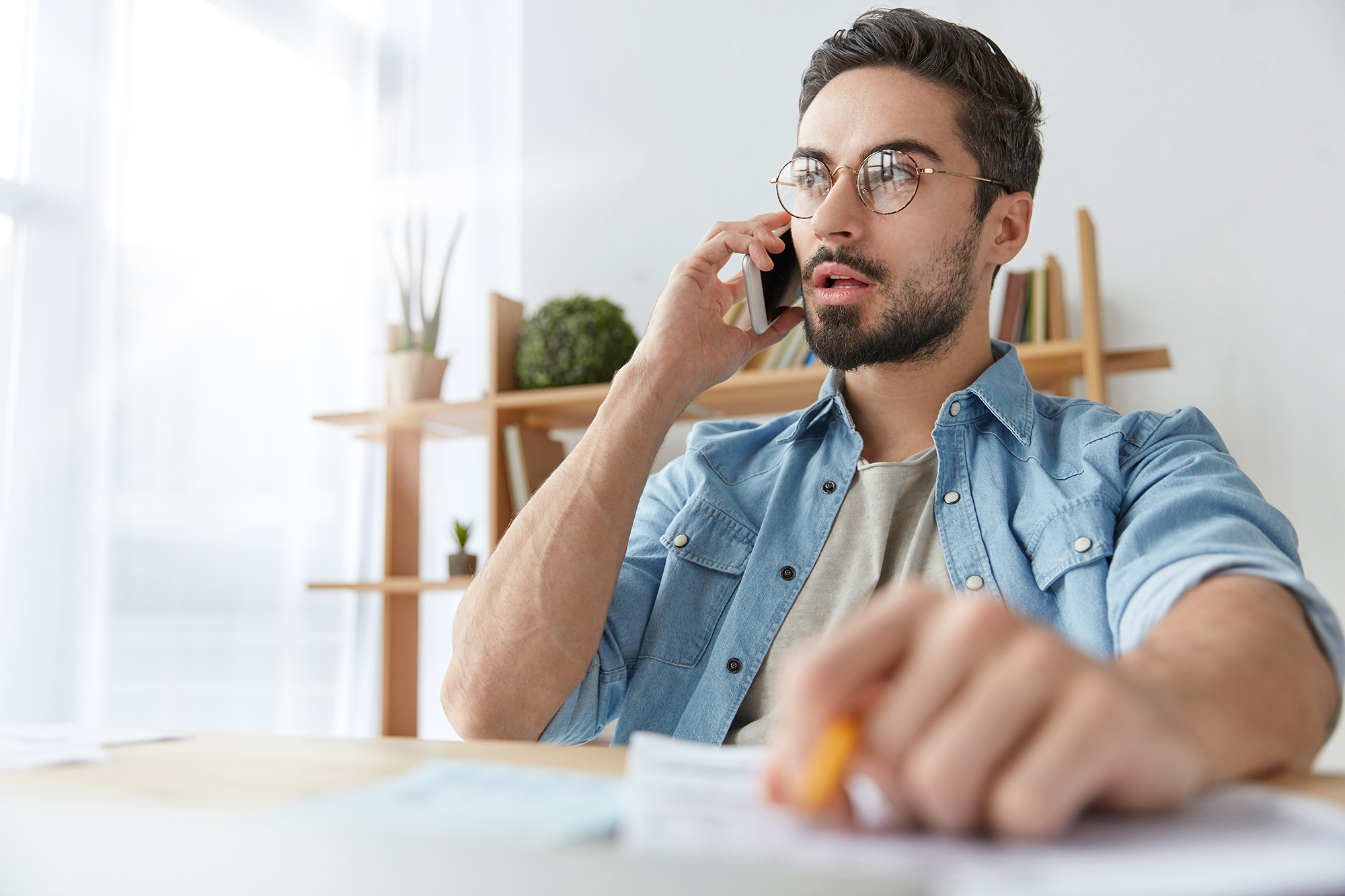 Man talking to someone on the phone. (Image: Shutterstock)