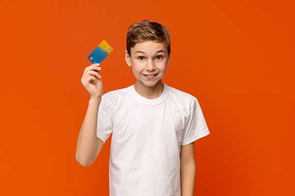 Boy with a HyperJar card. (Image: HyperJar)