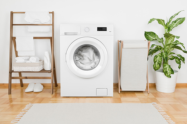 A washing machine in a laundry room. (Image: Shutterstock)