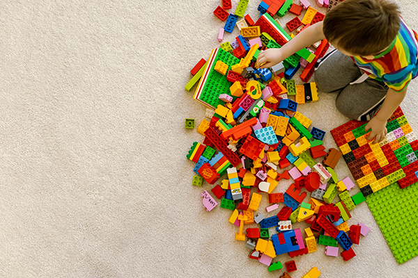 A voy playing with Lego. (Image: Shutterstock / Kostikova Natalia)