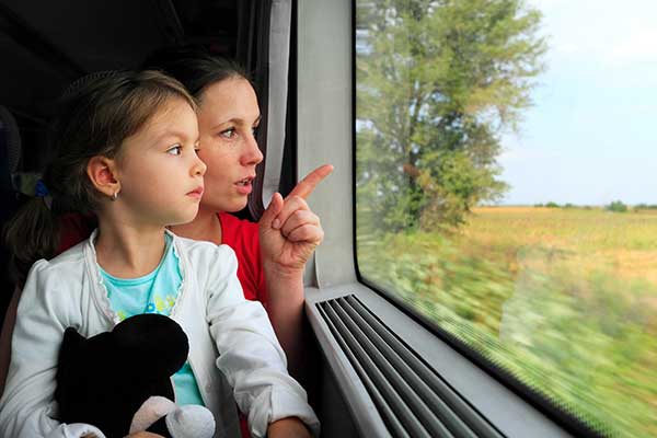 Mother and daughter on a train. (Image: Shutterstock)