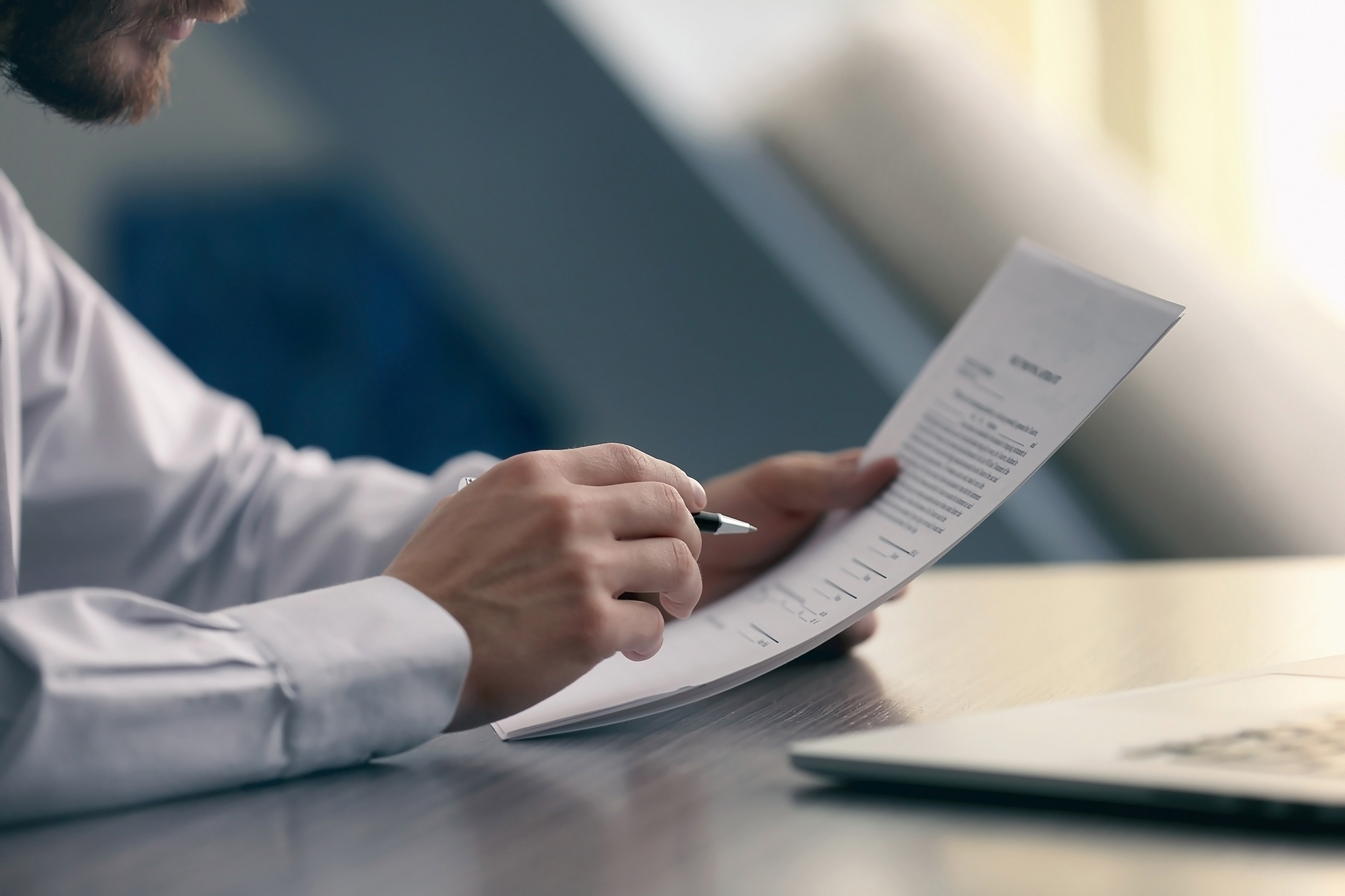 Man looking at documents. (Image: Shutterstock)