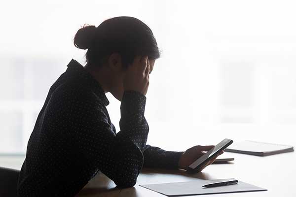 Upset woman on the phone. (Image: Shutterstock)