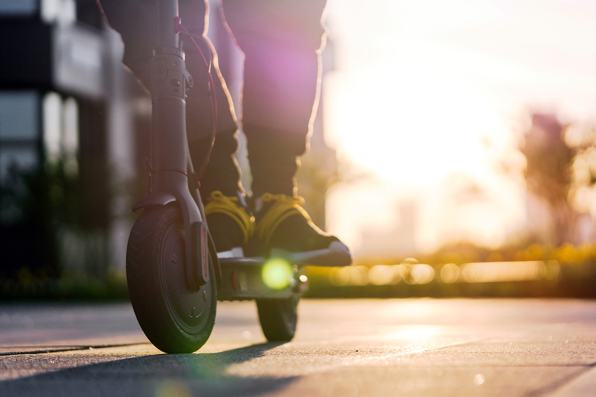 Close up of a man on a scooter. (Image: Shutterstock)