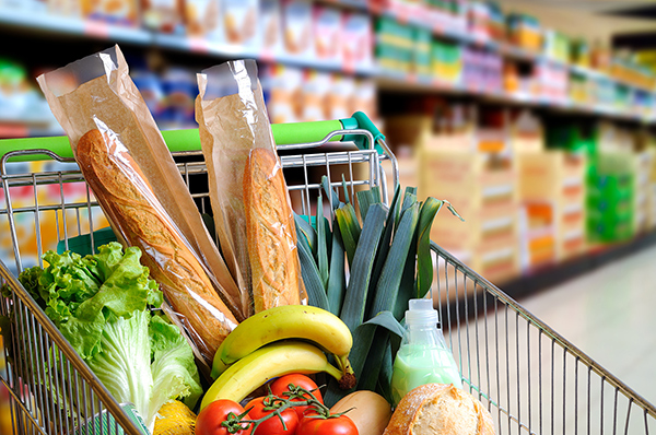 A shopping trolley full of groceries. (Image: Shutterstock)