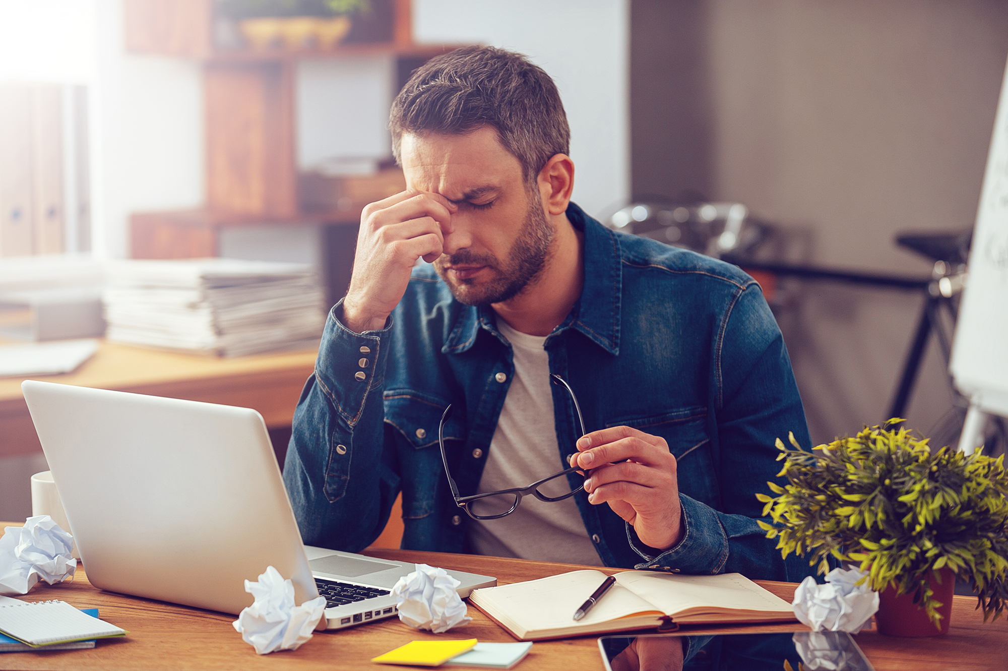 Stressed male worker. (Image: Shutterstock)