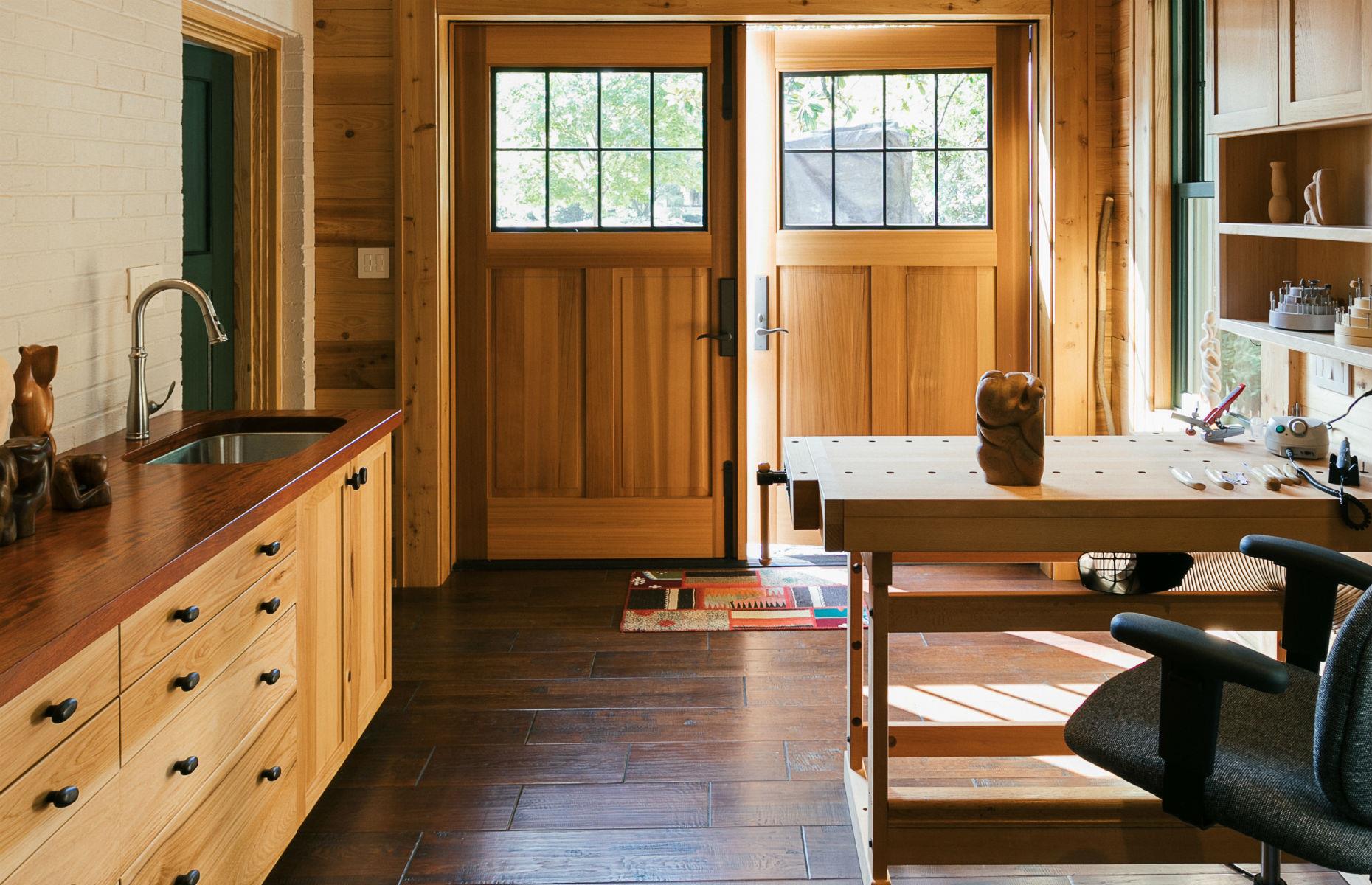 The garage of this 85-year-old home was transformed from a sad storage space into a sleek studio. Image: Handcrafted Homes, Inc.