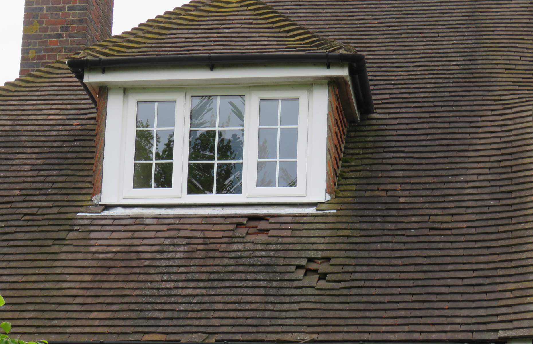 Look out for cracked tiles, crumbling cement and loose flashing. Image: Brian Clifford/Shutterstock