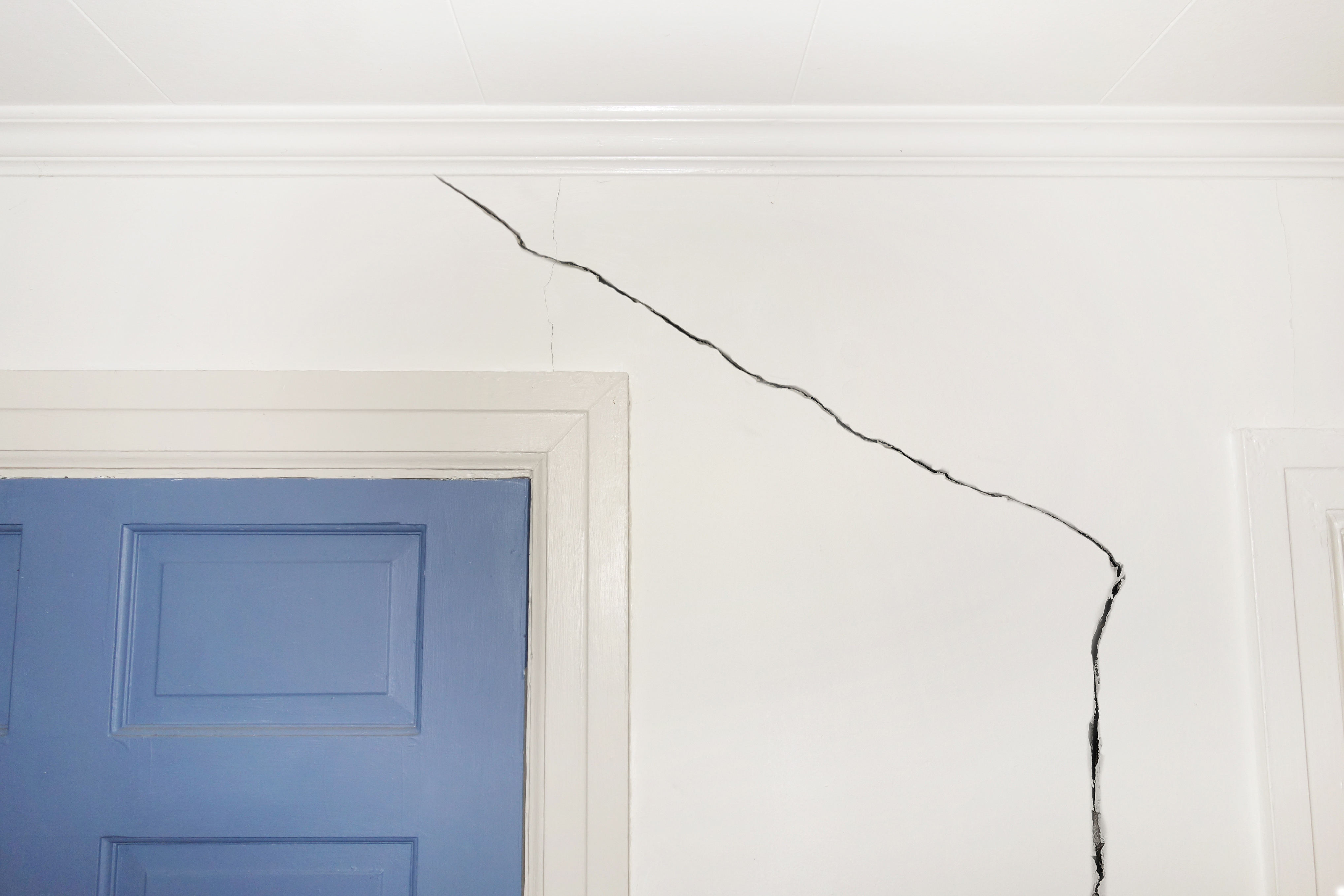 Tell-tale cracks around windows and doors can suggest structural problems. Image: zimmytws/Shutterstock