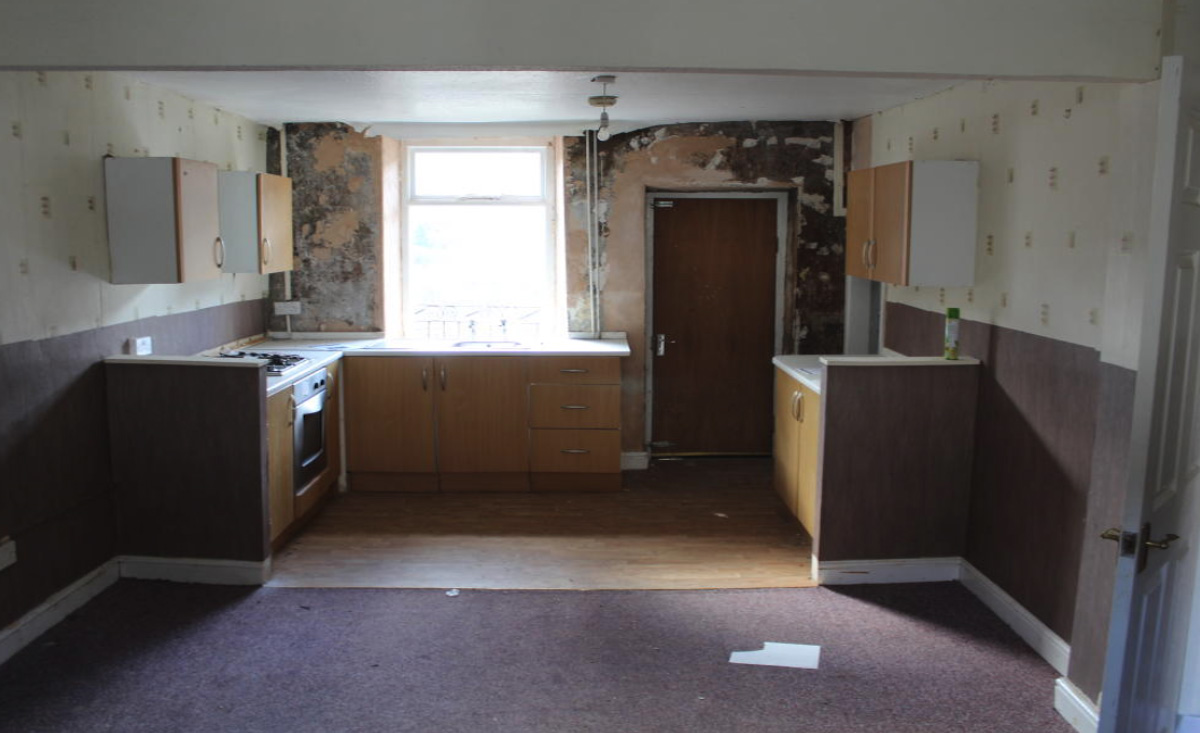 Inside, the interior walls look to be affected by damp. Image: Auction House