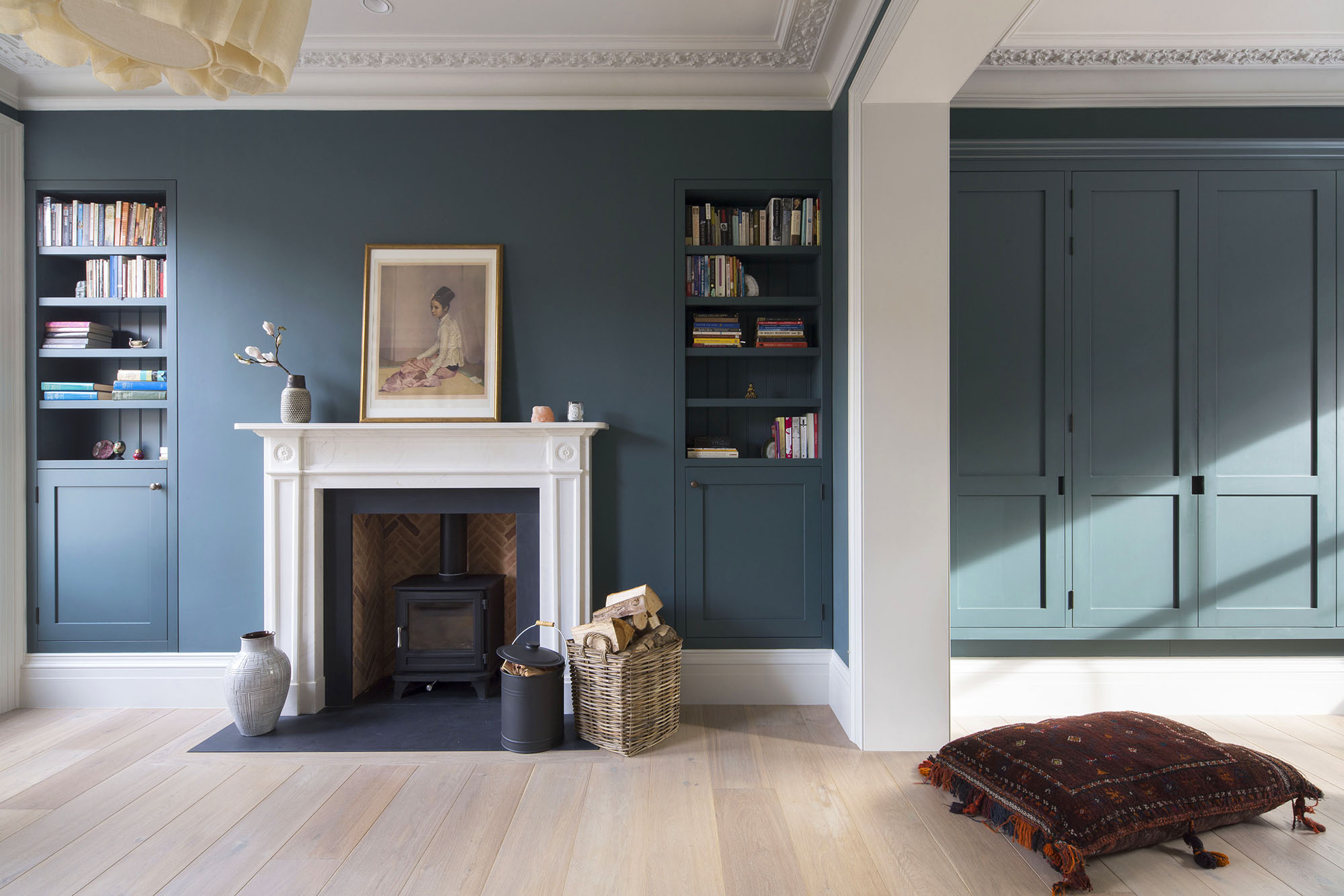 This thoughtful restoration features a charming herringbone brick hearth.  Image: Cousins and Cousins