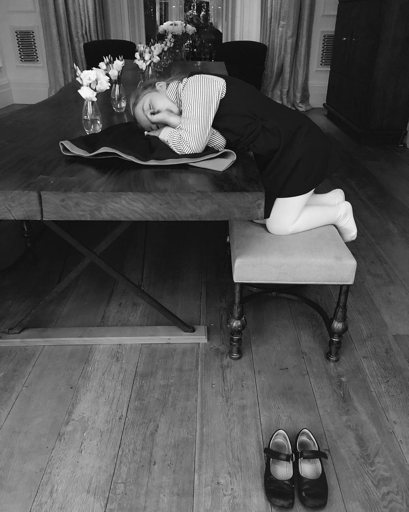 Harper Beckham proves a wooden table is an all-rounder. Image: @victoriabeckham / Instagram